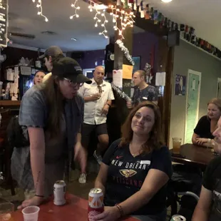 a group of people sitting around a table
