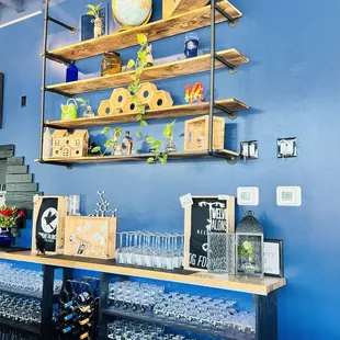 a shelf of wine glasses