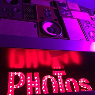 Walls of speakers and a photo booth