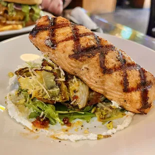 Adding salmon to the harissa Brussels appetizer = 20 Tap pro move