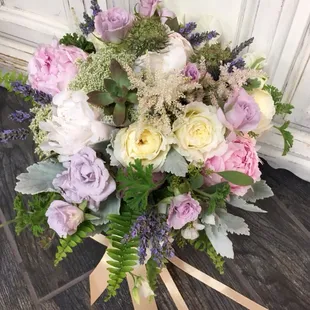 Garden roses, ranunculus, peony's, Queen Anne's lace, lavender herb, blush astilbe and scented geranium with Dusty Miller foliage