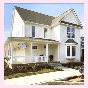 the front of a white house