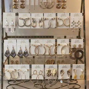 a display of earrings and necklaces