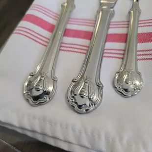 Bees on the silverware.