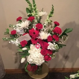 The overall size was approximately 2.5ft. H x 2ft. W set in a clear glass vase.