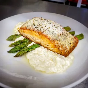 Parmesan Crusted Norwegian Salmon with parmesan risotto, grilled asparagus, and lemon oil drizzle