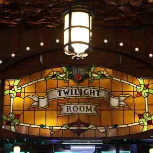 Twilight Room's stained glass crest above the bar.