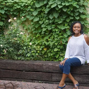 a woman sitting on a bench