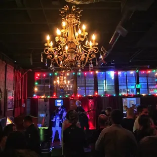 a chandelier and a crowd of people