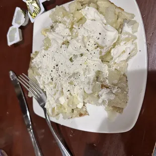 Baked potato with butter and sour cream