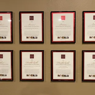 a wall of framed wines