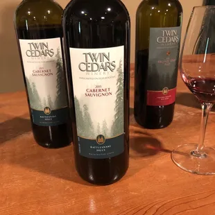 three bottles of wine on a table