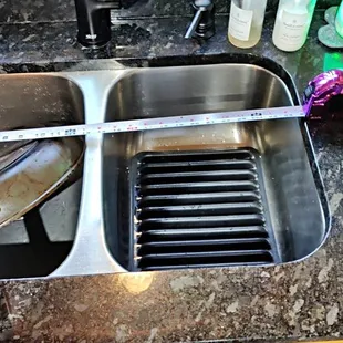 Hard to fill a pot, let alone wash a pan in this tiny sink (both sides equal size)... tiny