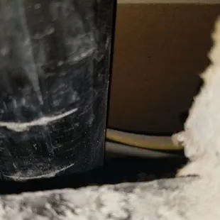 Installer cut into pvc pipe behind wall when cutting drywall to adjust the granite countertops. Another angle.