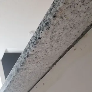 Granite on bottom side dusty and full of dirt/powder.  This maybe normal as this is the first time I ever got granite countertops installed.
