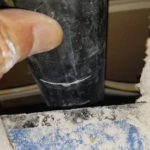 Installer cut into pvc pipe behind wall when cutting drywall to adjust the granite countertops.