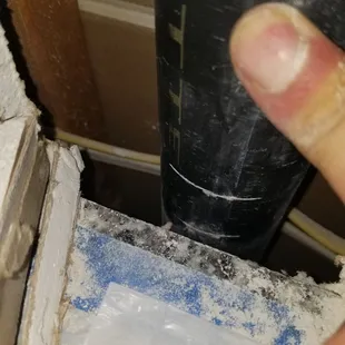 Installer cut into pvc pipe behind wall when cutting drywall to adjust the granite countertops. Another angle.