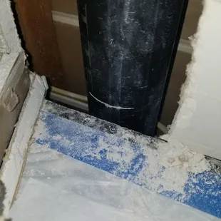 Installer cut into pvc pipe behind wall when cutting drywall to adjust the granite countertops. Another angle.