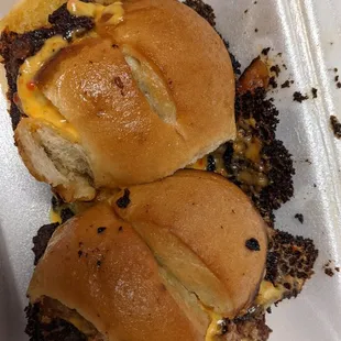 Slap burnt up sliders. After returning the raw slider. Man was mad and burnt them.