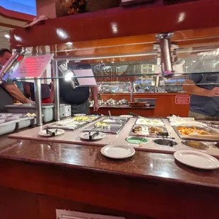 two people serving food