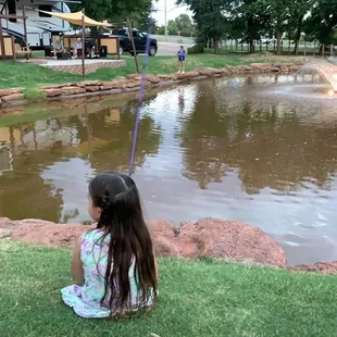 My baby girl fishing at the catch-and-release pond
