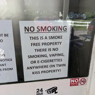 There are 6 or so no smoking signs