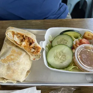 Chicken wrap with pimento cheese and sriracha with a side salad