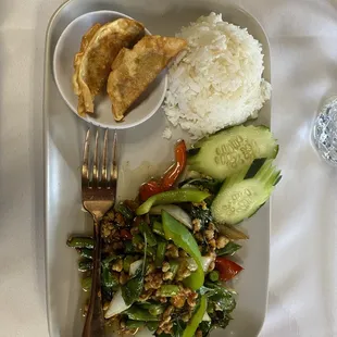 a plate of food with rice and vegetables