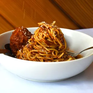 a bowl of spaghetti and meatballs