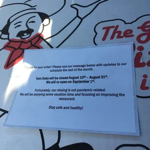 a sign stating that the restaurant is closed