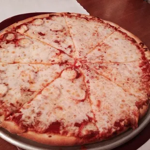 a cheese pizza on a pizza pan