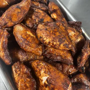 a pan full of chicken wings