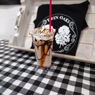 a chocolate milkshake with whipped cream and caramel