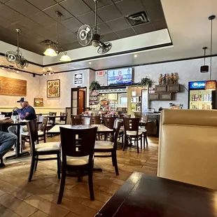 people sitting at tables in a restaurant