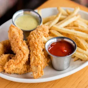 a plate of fried food with dipping sauce