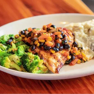 a plate of food on a wooden table