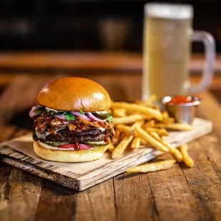 a burger and fries on a wooden table