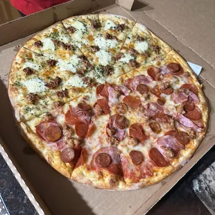 Half Spicy Sausage and Honey Pizza and half All Meat Pizza