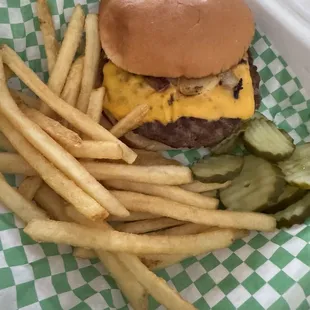 Cheeseburger w/extra grilled onions and extra pickles and fries.