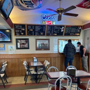 two people standing at the counter