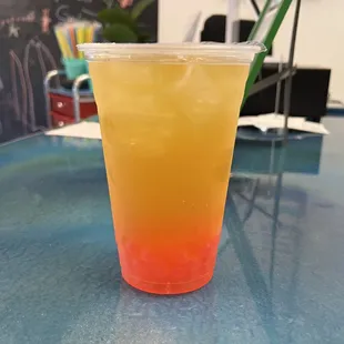 A Mango Fruit Tea with Strawberry Bubbles!