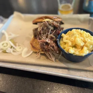 Pulled pork sandwich with mac &apos;n cheese.