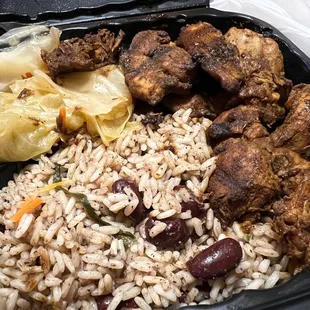 Jjerk chicken, peas and rice and cabbage