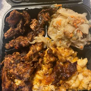 Jerk chicken meal with Mac n cheese and cabbage
