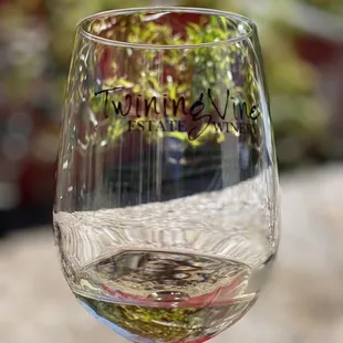 a hand holding a wine glass