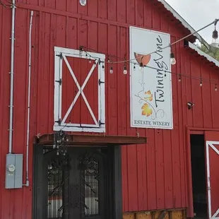 a red barn with white trim