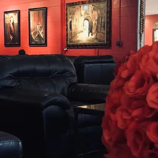 red walls and black leather chairs