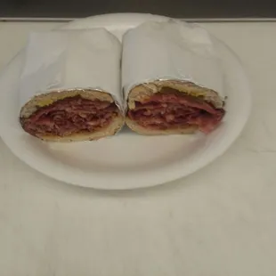 two halves of a sandwich on a plate