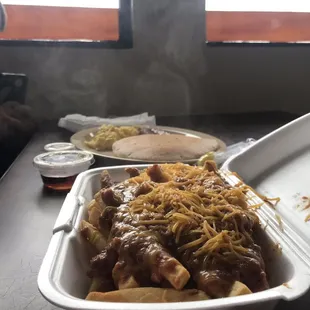 a container of chili and cheese fries