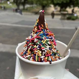 Chocolate soft serve in a cup, chocolate dip, rainbow sprinkles